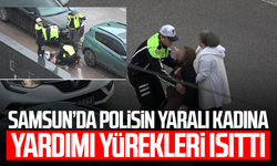Polisin yaralı kadına yardımı yürekleri ısıttı: Kaldırıma taşıdı, ıslanmasın diye yelekle korudu